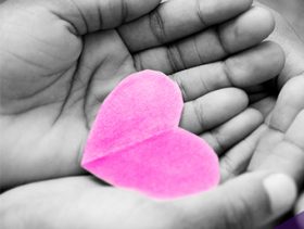 hand holding paper heart