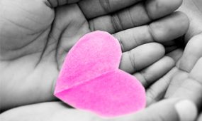 hand holding paper heart