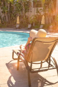 SMOV cancer survivor Shannon Phillips lounging in a pool chair at GPP