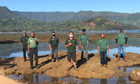 Hanalei Bay Resort Grounds team at beach low tide with mask