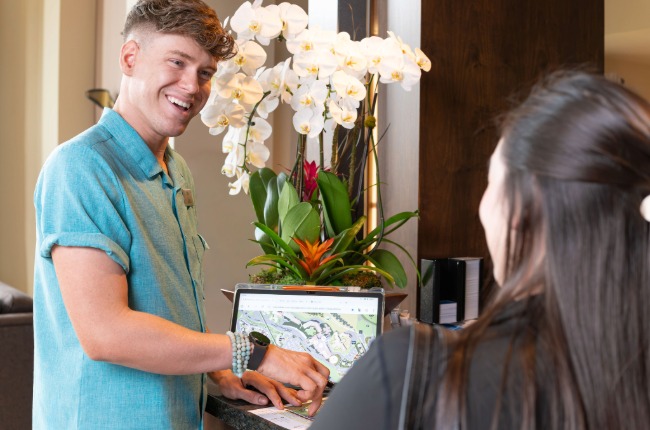 front desk agent helping guest